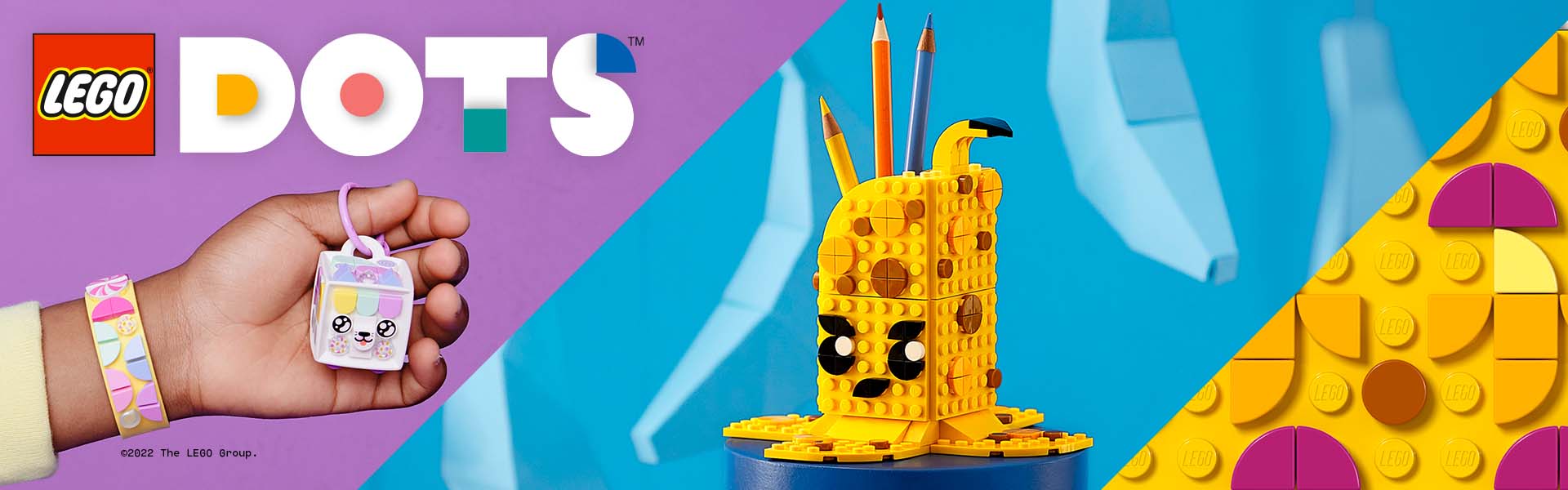 Lego DOTS-Set mit Hand und Stiftehalter in Gelb und Lila.